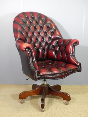 Lot 712 - A contemporary ox-blood red leather...