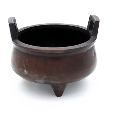 Lot 69 - A Chinese bronze tripod censer, with raised...