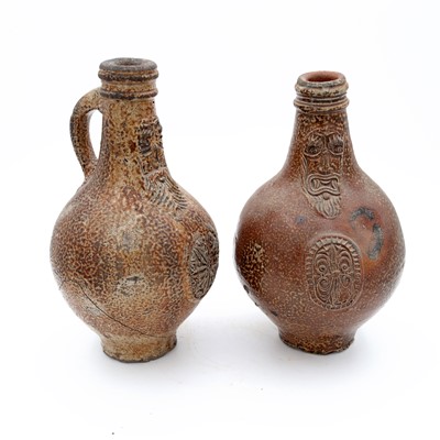 Lot 75 - A German salt glazed stoneware bellarmine,...