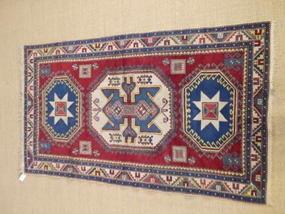 Lot 773 - A Turkish woollen red, blue and cream ground...