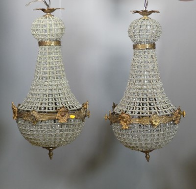 Lot 711 - A pair of gilt metal and moulded glass drop...