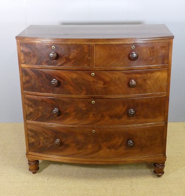 Lot 730 - A Regency mahogany and flame mahogany bowfront...