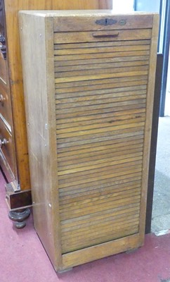 Lot 617 - A 1930s Simpoles oak tambour-fronted office...