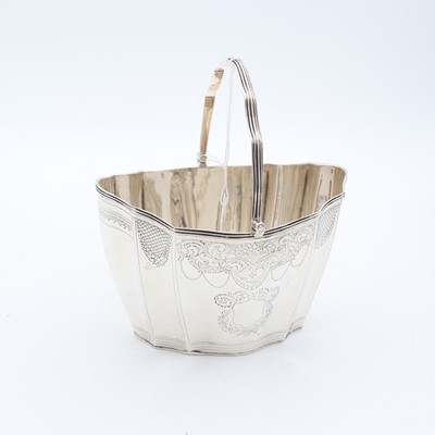 Lot 265 - A George III silver basket, of serpentine form,...