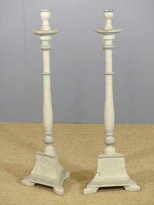 Lot 638 - A pair of grey-painted table candle stands,...