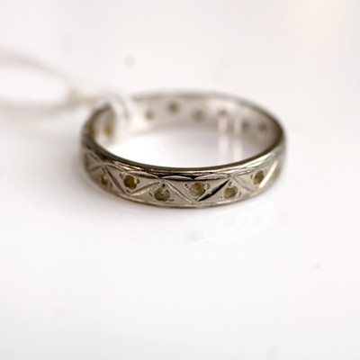 Lot 270 - A silver and paste set eternity ring, size O,...