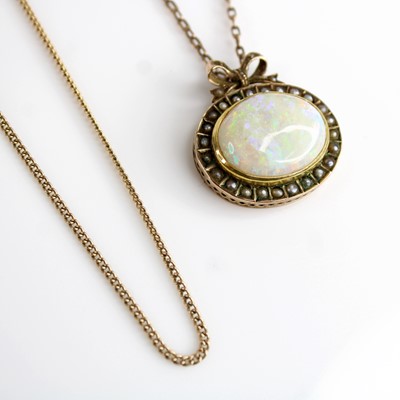 Lot 281 - A yellow metal, cabochon opal and seed pearl...
