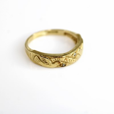 Lot 285 - A 14ct gold diamond point set and carved band...