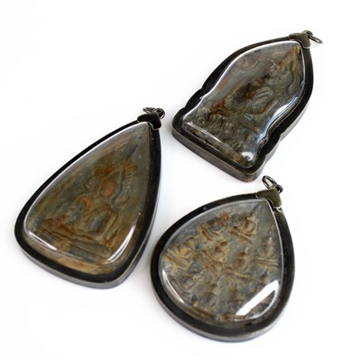 Lot 288 - Three white metal mounted Thai Buddha amulet...