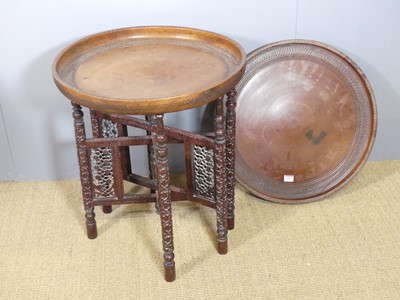 Lot 747 - An Eastern carved and stained softwood...