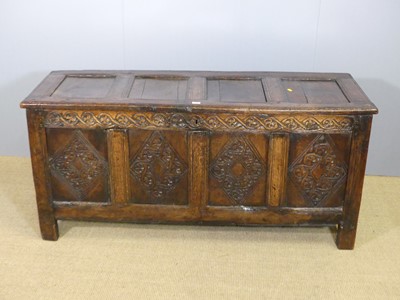 Lot 753 - An 18th century joined and later relief carved...