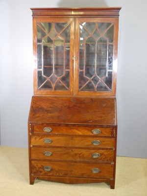 Lot 755 - An early 19th century mahogany bureau bookcase,...