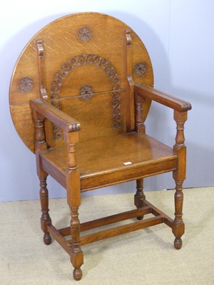 Lot 757 - An early 20th century oak fold-over monk's...