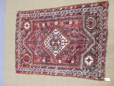 Lot 763 - A Persian woollen red and cream ground Shiraz...