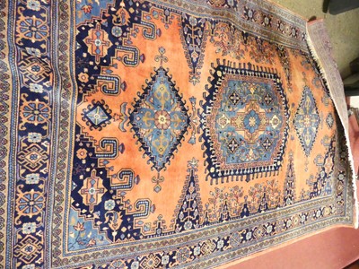 Lot 767 - A Persian woollen red and blue ground Tabriz rug