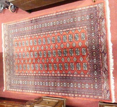 Lot 768 - A Persian woollen red ground Bokhara rug, 184...