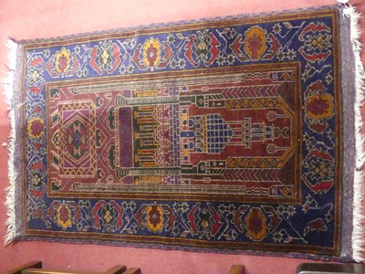 Lot 772 - A Persian woollen red and blue ground prayer...