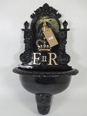 Lot 655 - A painted cast metal wall-mounted garden tap,...