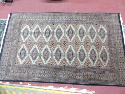 Lot 774 - A Persian woollen brown ground Bokhara rug,...