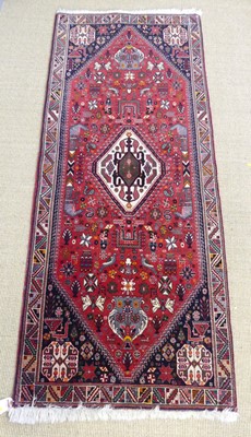 Lot 775 - A Persian woollen red, blue and cream ground...
