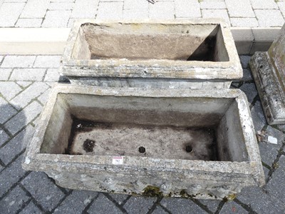 Lot 782 - A pair of reconstituted stone garden trough...