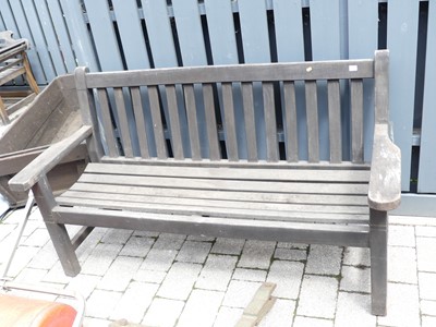 Lot 786 - A contemporary slatted teak three-seater...