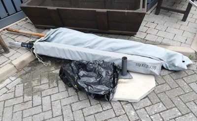 Lot 788 - A garden folding parasol, with concrete base,...