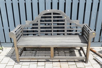 Lot 790 - A contemporary slatted teak three-seater...