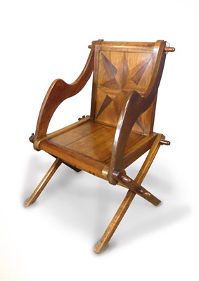 Lot 461 - An Arts & Crafts walnut and star inlaid...