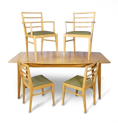 Lot 467 - A mid-century walnut dining suite, probably by...