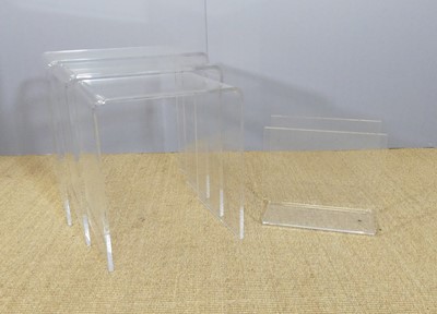 Lot 503 - A lucite nest of three occasional tables, of...