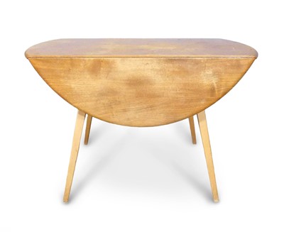 Lot 470 - An Ercol blond elm and beech dropflap 'Windsor'...