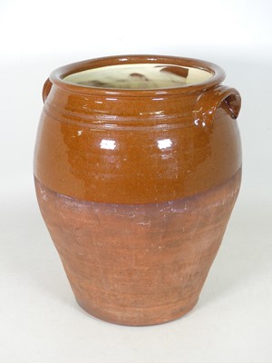 Lot 46 - A salt-glazed terracotta crock, flanked by...