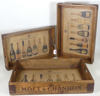 Lot 61 - A graduated set of three stained pine drinks...