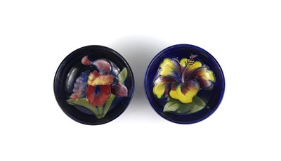 Lot 233 - A pair of Moorcroft Hibiscus pattern pottery...