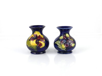 Lot 234 - A pair of Moorcroft Hibiscus pattern pottery...