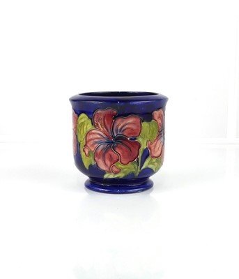 Lot 240 - A Moorcroft Hibiscus pattern pottery footed...