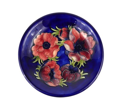 Lot 241 - A Moorcroft Anemone pattern pottery circular...