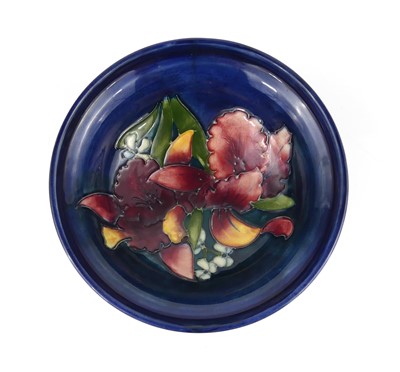 Lot 243 - A Moorcroft Orchid pattern pottery footed...