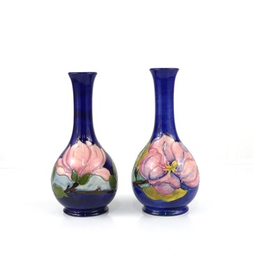 Lot 244 - A matched pair of Moorcroft Magnolia pattern...