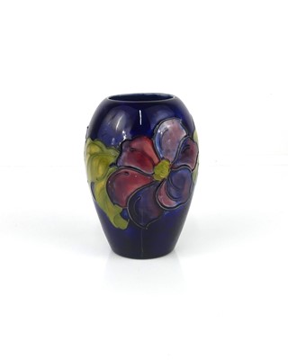 Lot 246 - A Moorcroft Clematis pattern pottery ovoid...