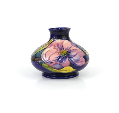 Lot 248 - A Moorcroft Magnolia pattern pottery squat...