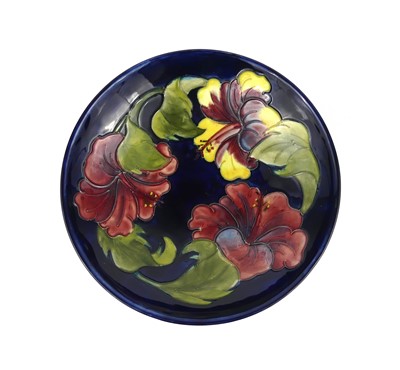Lot 249 - A Moorcroft Hibiscus pattern pottery footed...