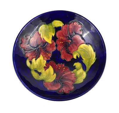 Lot 250 - A Moorcroft Hibiscus pattern pottery footed...