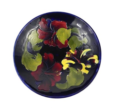 Lot 251 - A Moorcroft Hibiscus pattern pottery footed...
