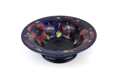 Lot 256 - A Moorcroft Pansy pattern pottery footed table...