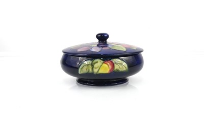 Lot 260 - A Moorcroft Clematis pattern pottery squat...