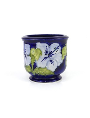 Lot 265 - A Moorcroft Blue Hibiscus pattern pottery...