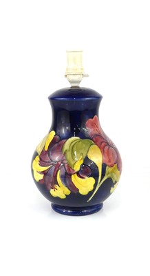 Lot 277 - A Moorcroft Hibiscus pattern pottery table...