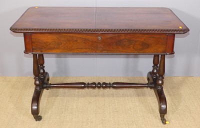 Lot 237 - A George IV rosewood writing table, the top...